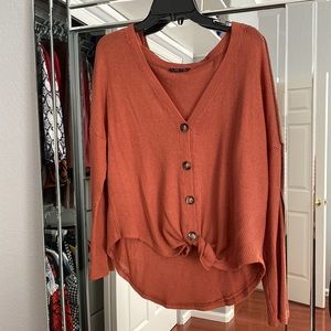 Orangish red sweater
